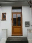 Haustür mit festverglastem Oberlicht und wärmegedämmter Holzfüllung